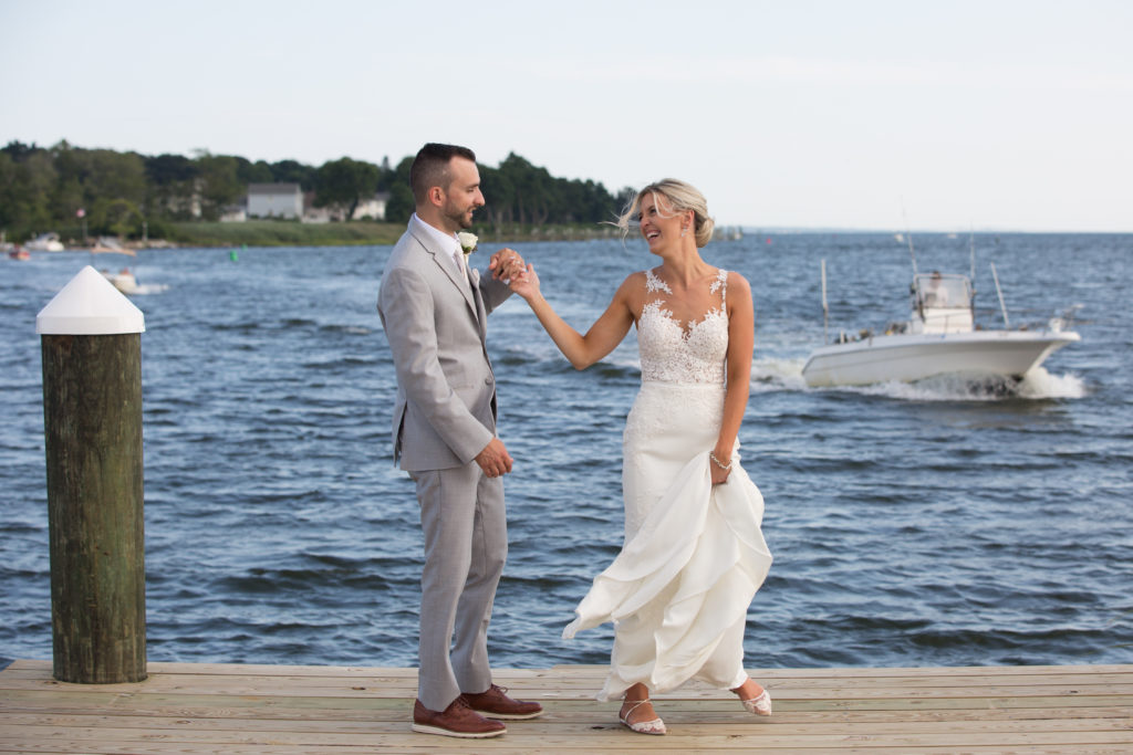A Bride and Groom dance on the docks of Harbor Lights in Warwick Rhode Island.