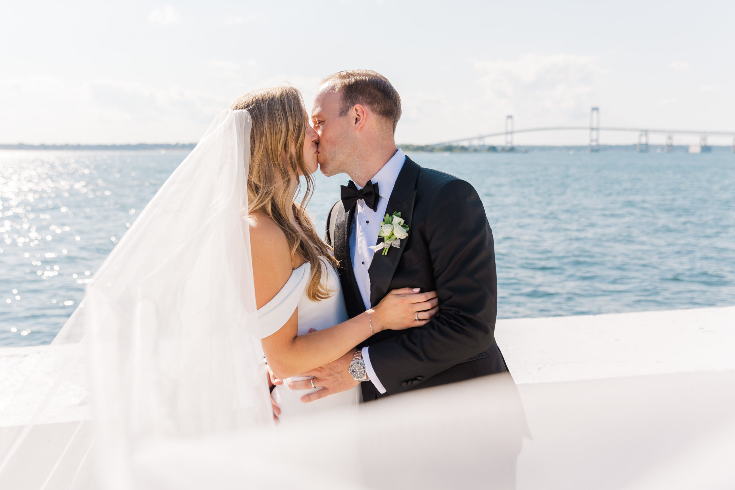 Bride and groom kiss at Belle Mer in Newport.