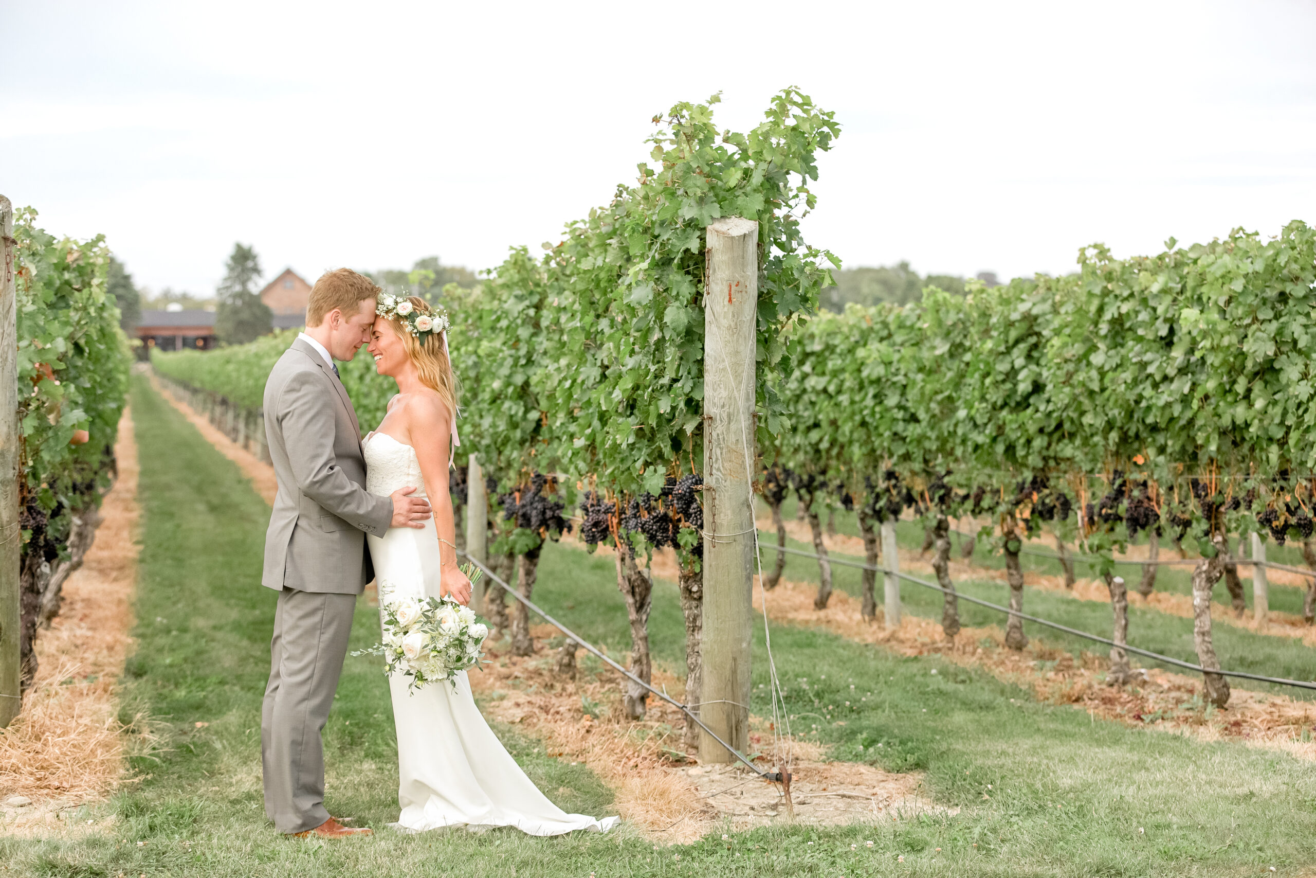 A bride and groom share a moment on their wedding day at Newport Vineyards in Middletown RI. 