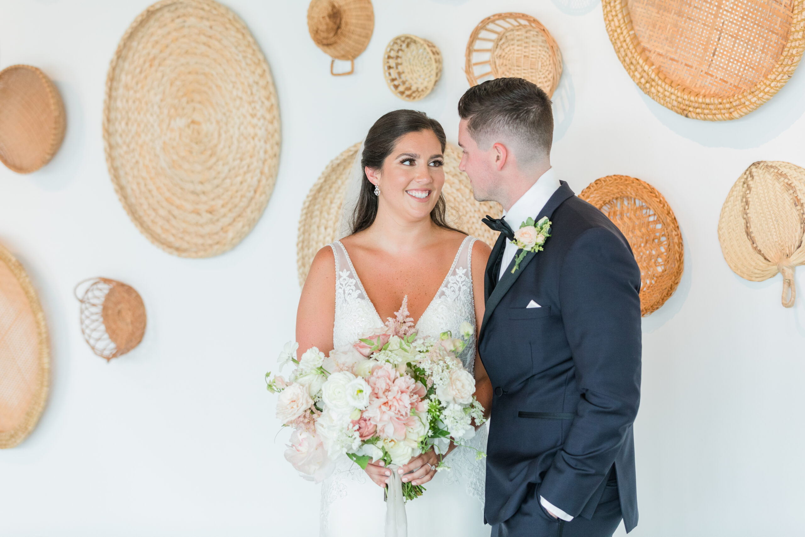 A bride and groom share a moment inside the Newport Beach House