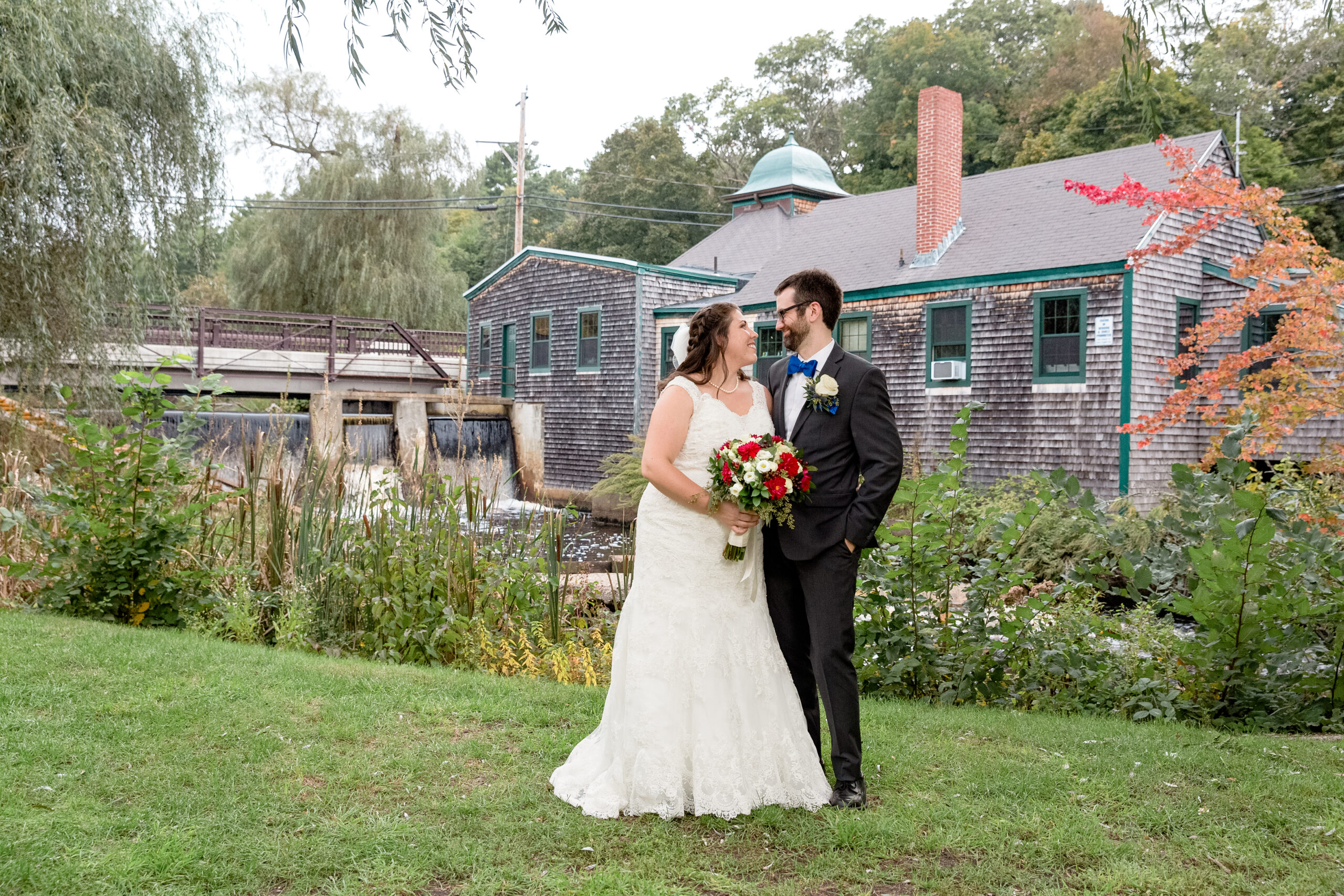 A bride and groom enjoy a moment outside at the Jones River Trading Post. 