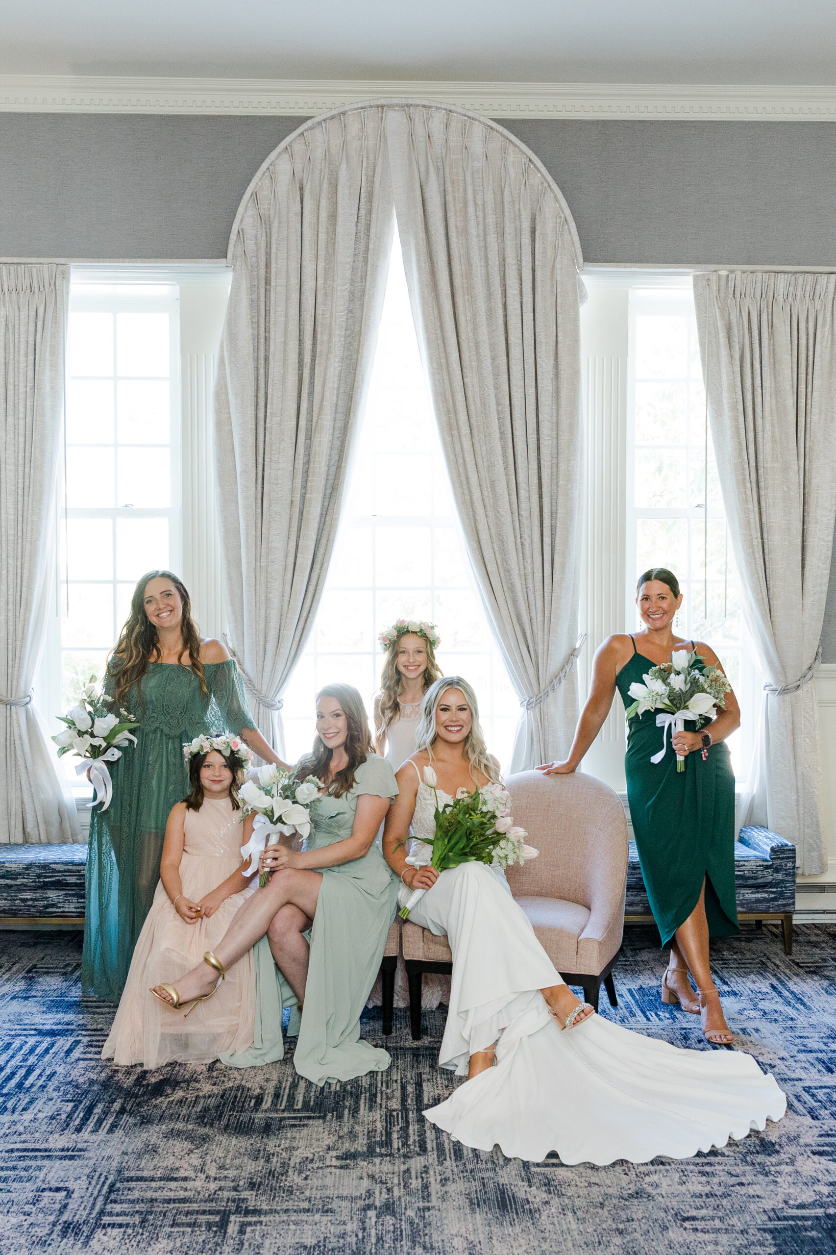 A bride sits with her bridesmaids at the Hotel Viking in Newport. 