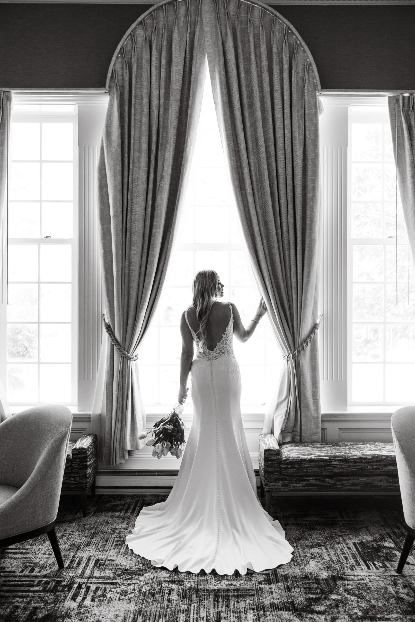 A bride poses in the window of the Hotel Viking in Newport. 