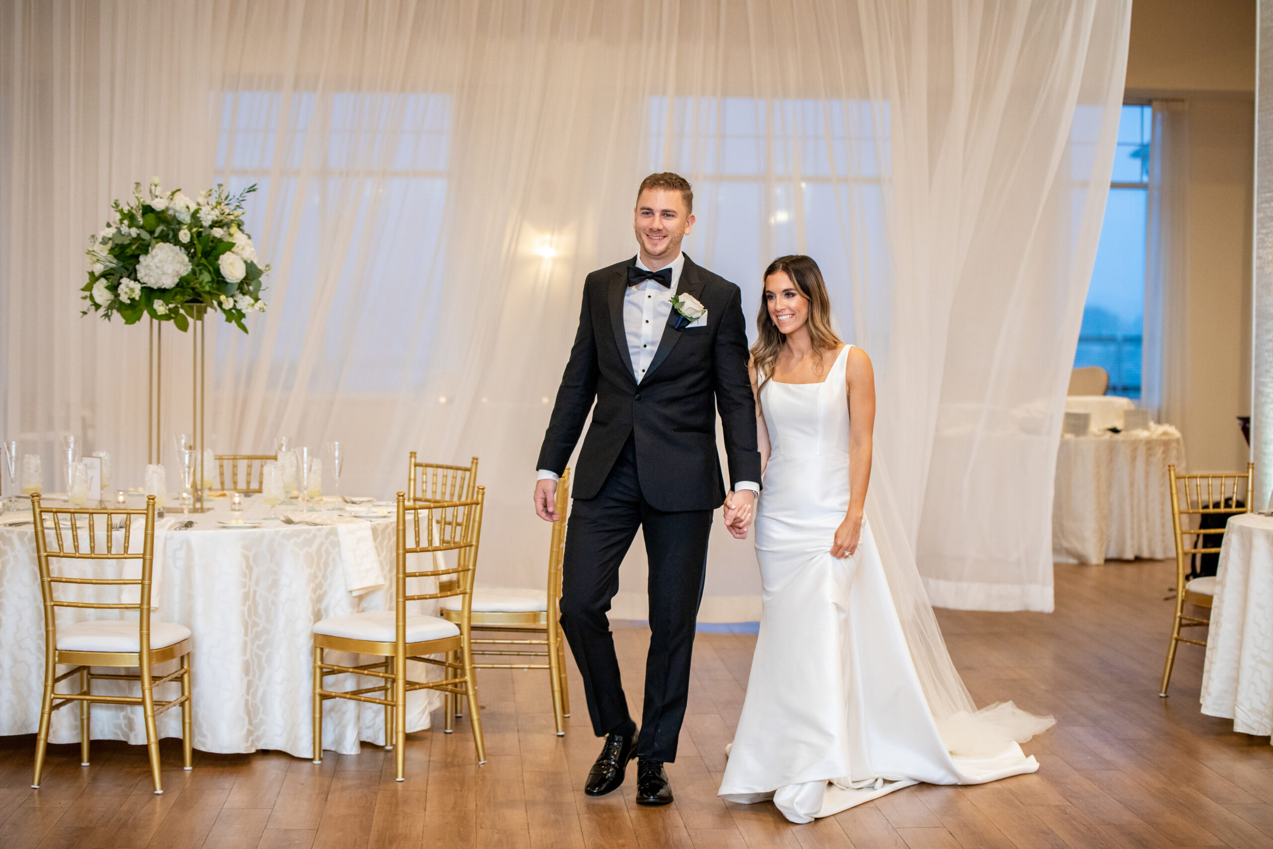 A Bride and Groom enter their reception at the Wyndham Newport Hotel. 