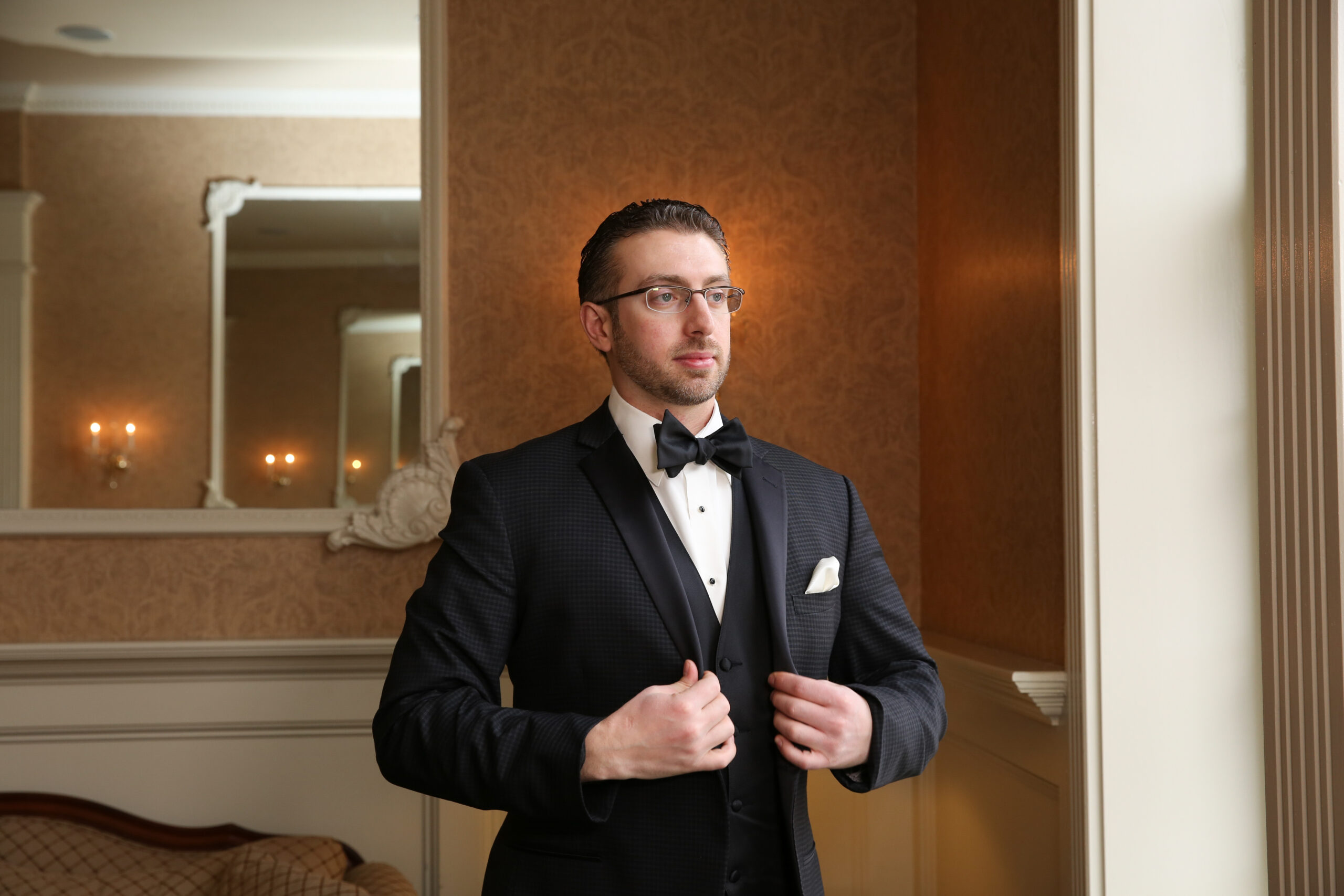 A groom gets ready at the Hotel Viking in Newport. 