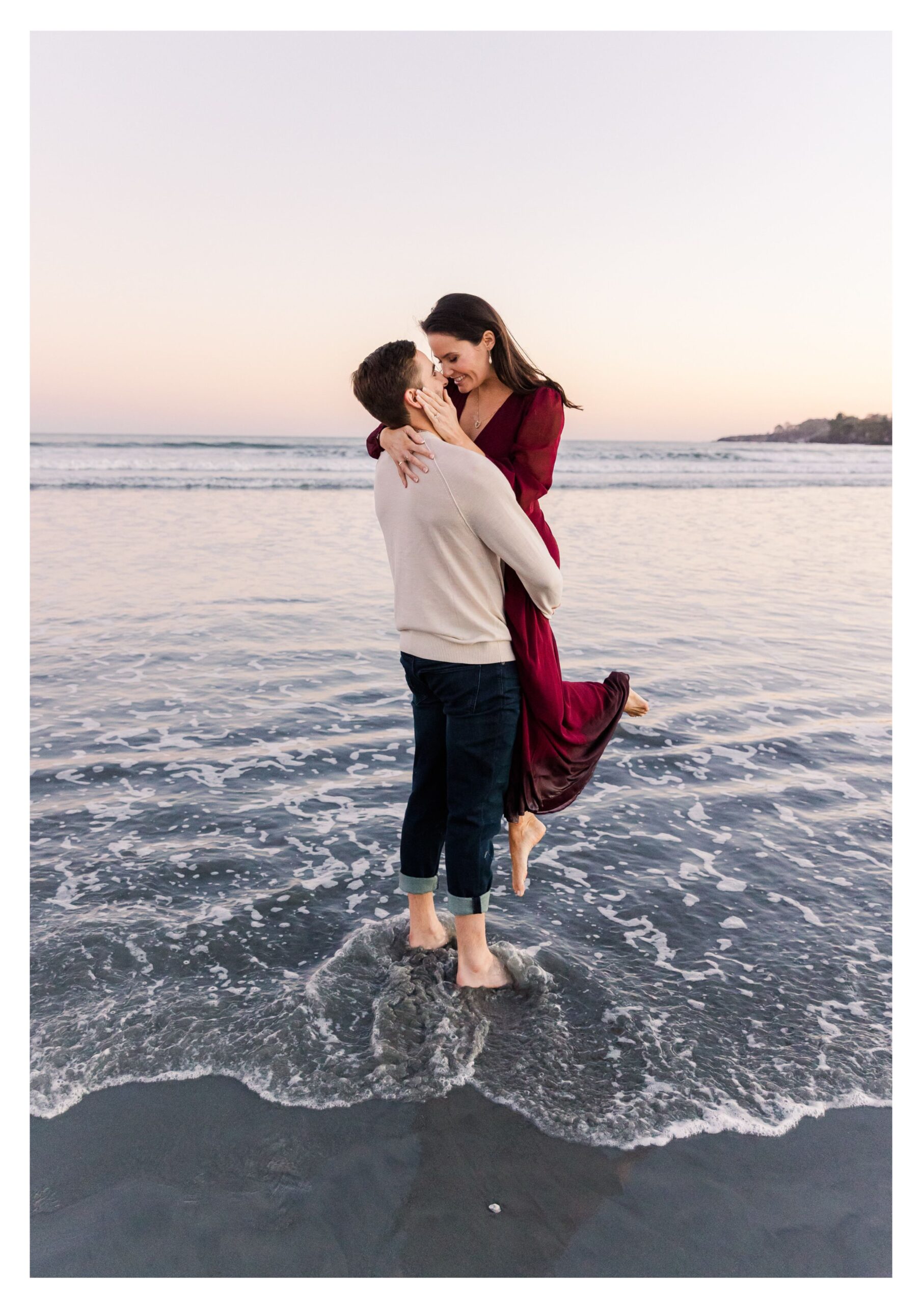 A newly engaged couple are enjoying a Beach Engagement Session on First Beach in Newport  Rhode Island