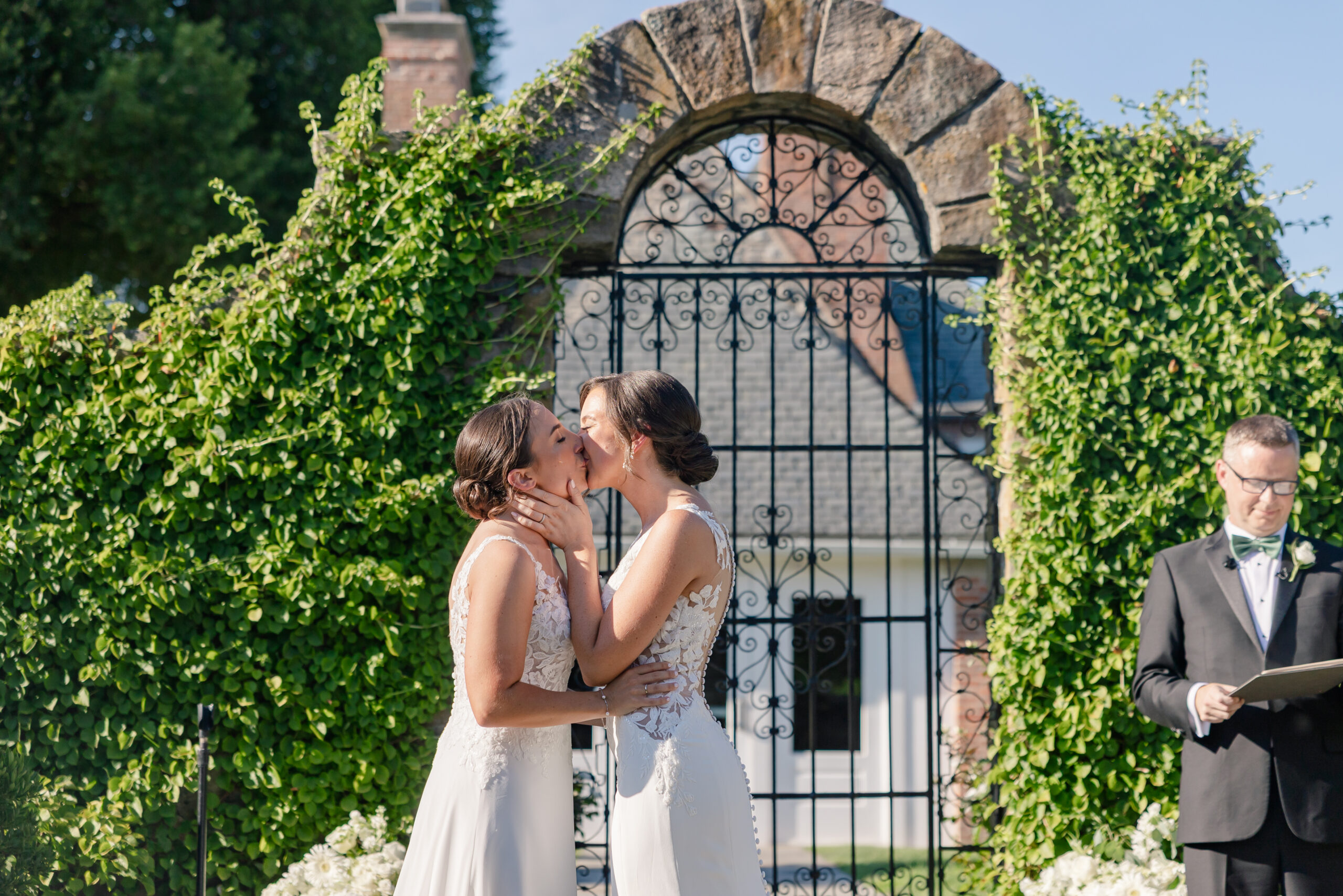 Two Brides kiss at their Shepherd's Run Ceremony in South Kingstown RI