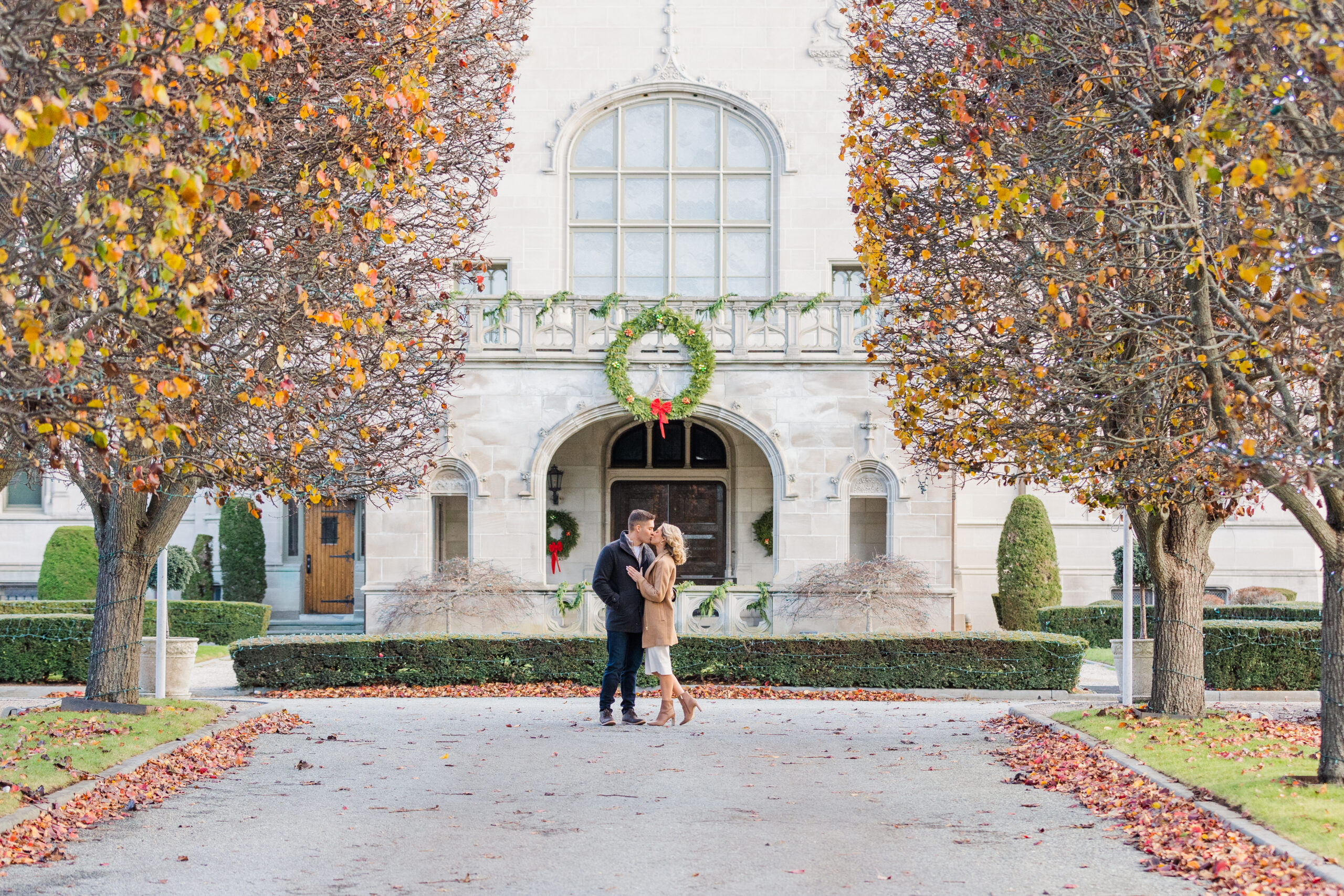 A couple snuggles in close during their winter engagement session at Ochre Court